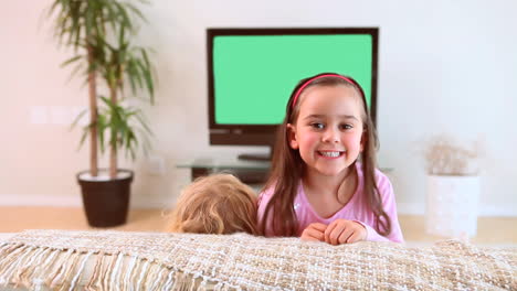 siblings watching the television