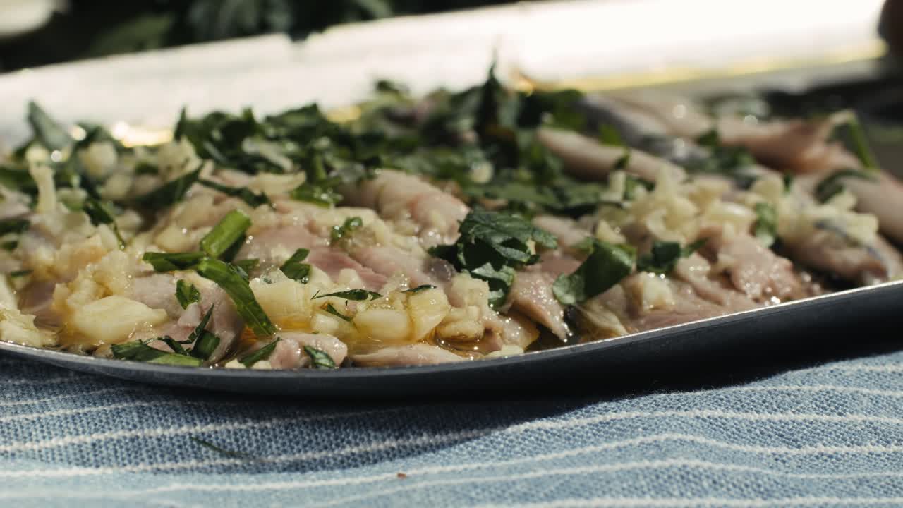 Fresh Sea sardines and Anchovy Fish and Mullus On Display On Ice On Market Store Shop. Seafood Fish Background, close up stand of small salty white fish.