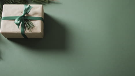 video of christmas presents with copy space on green background