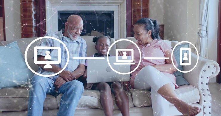 Family trio watching laptop booting as animated icons linking devices showing technology connection