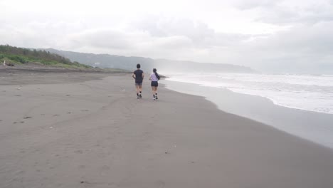 couple running on a beach