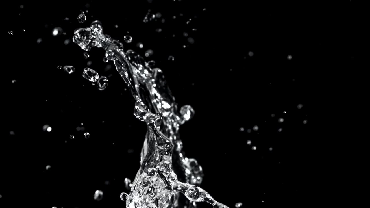 Slow Motion Water Splash and Droplets on Black Background