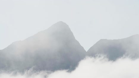 majestic mountains behind fog clouds in anderdalen national park, senja, norway