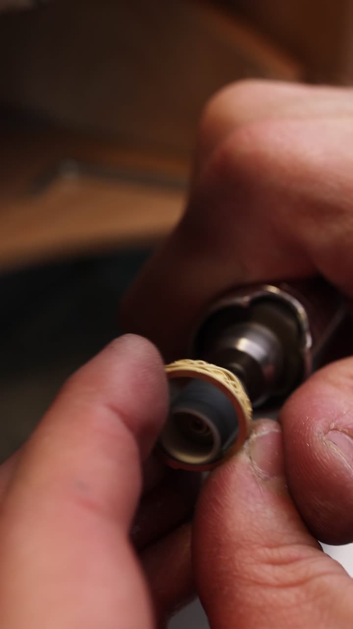 Close-up of Jeweler Polishing a Handmade Gold Ring