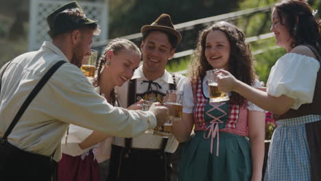 friends celebrating oktoberfest with beer