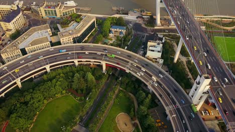 china sunny day shanghai city famous traffic round road junction aerial park view 4k