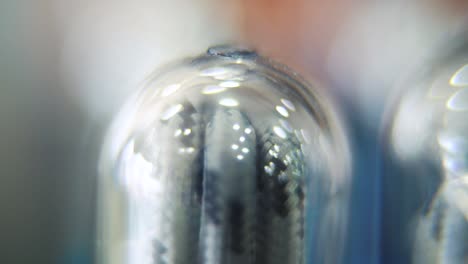 macro close up shot, usb wire in a round plastic cover, dreamy bokeh, charging cable in a glowing clear case