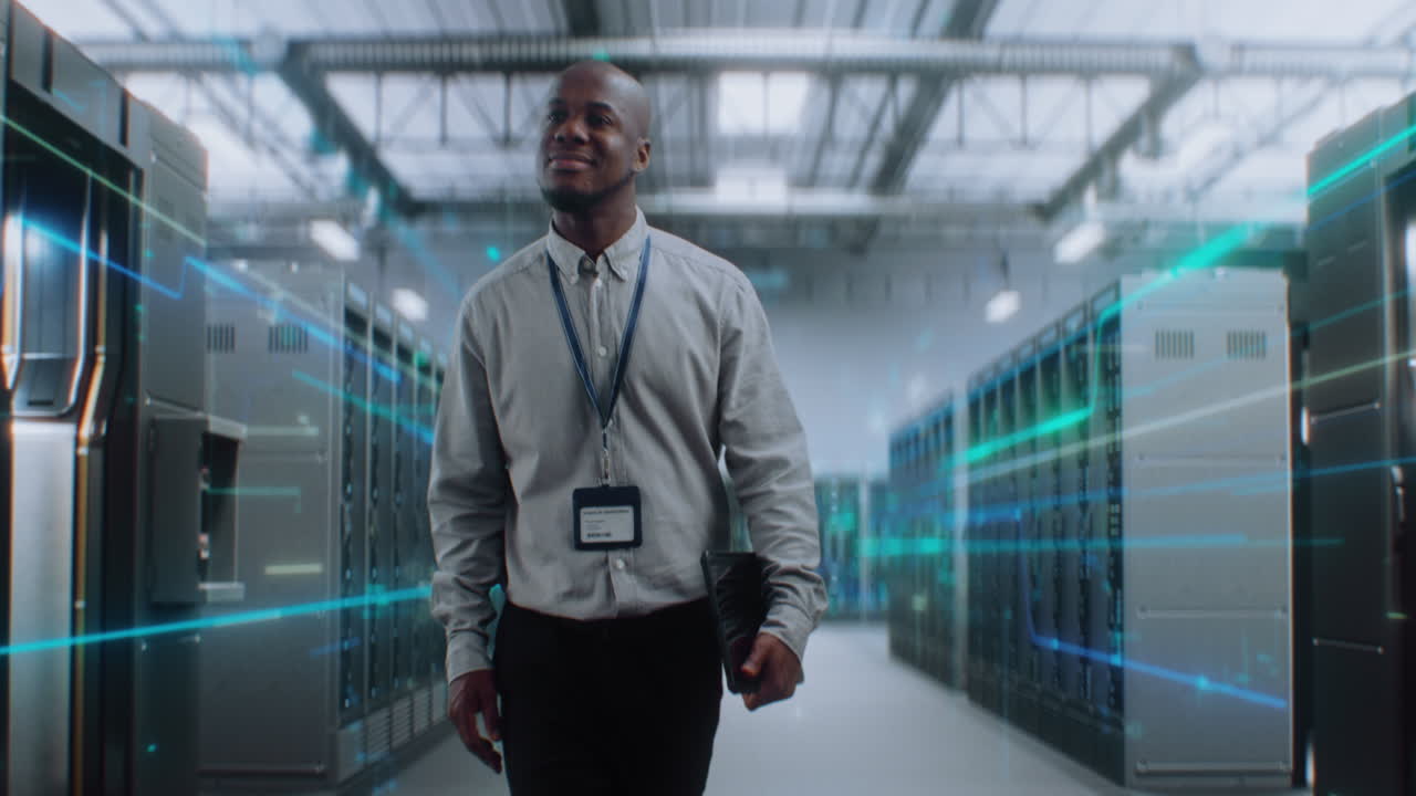 IT Professional Walking Through a Server Room / Data Center