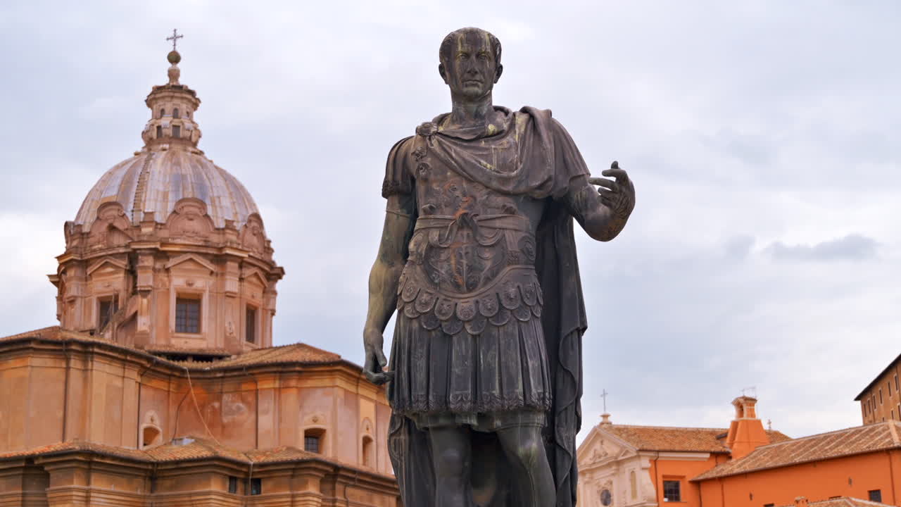 Rome, Italy - August 20, 2022: The bronze Statue of Julius Caesar on Via del Fiori Imperial