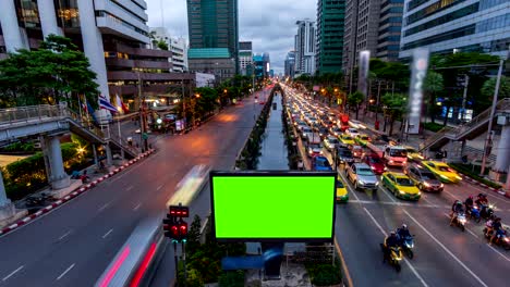 4k time lapse: billboard green screen with city night traffic lights background.