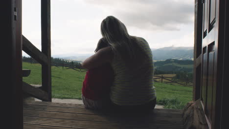 mother and child enjoying a mountain view