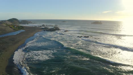 playa de matanzas chile surf and wind kite surfing, drone shot on the sunset travel right, seagulls puertecillo topocalma pupuya