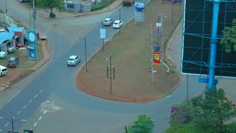 Aerial-Establishing-Shot-Over-Busy-Round-About-In-Rural-l-Town