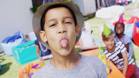 Boy-making-faces-while-friends-sitting-in-background-4k