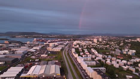 rainbow over the city of reykjavik aerial view iceland