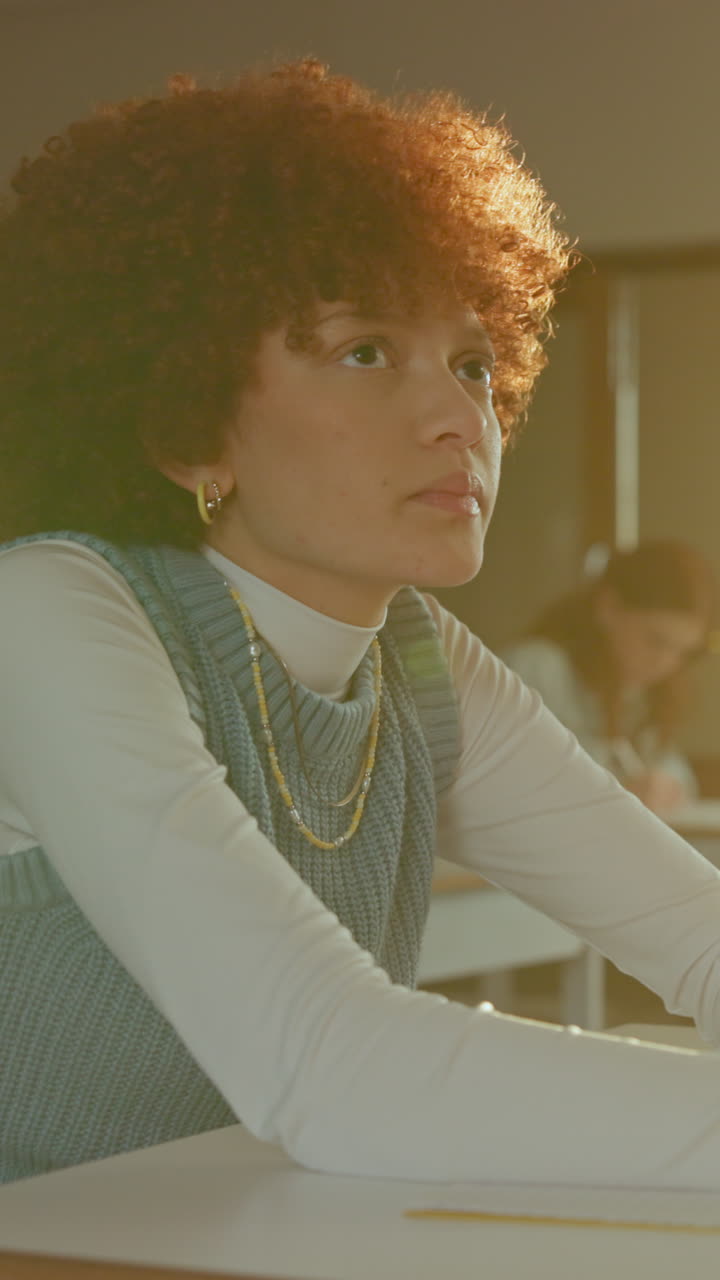 Focused Young Woman Student Concentrating in Class