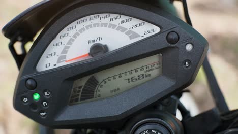 motorcycle dashboard with speedometer close up, ignition on.