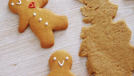 Gingerbread-dough-with-cookie-cutter-on-wooden-table-4k