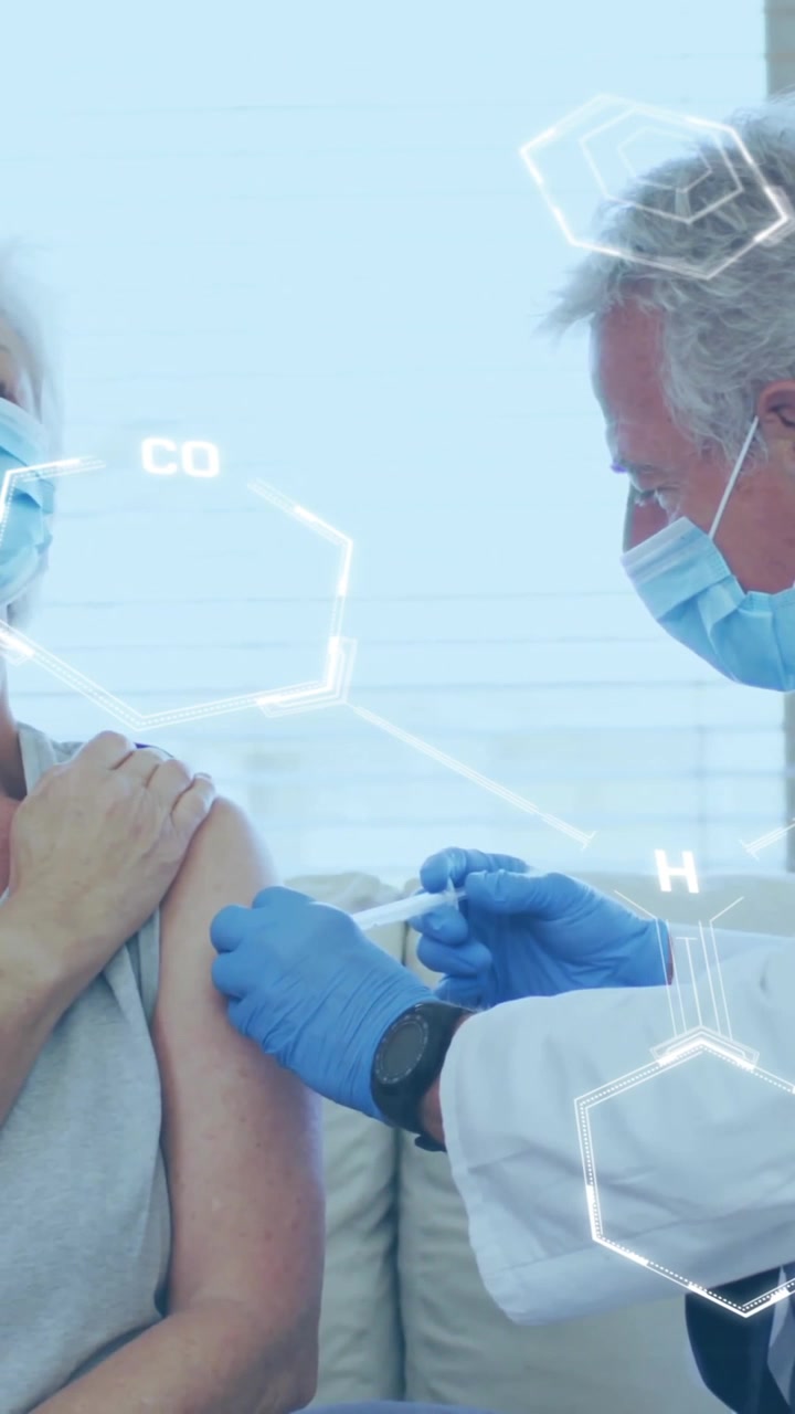 Animation of chemical formula over caucasian male doctor with patient holding vaccine