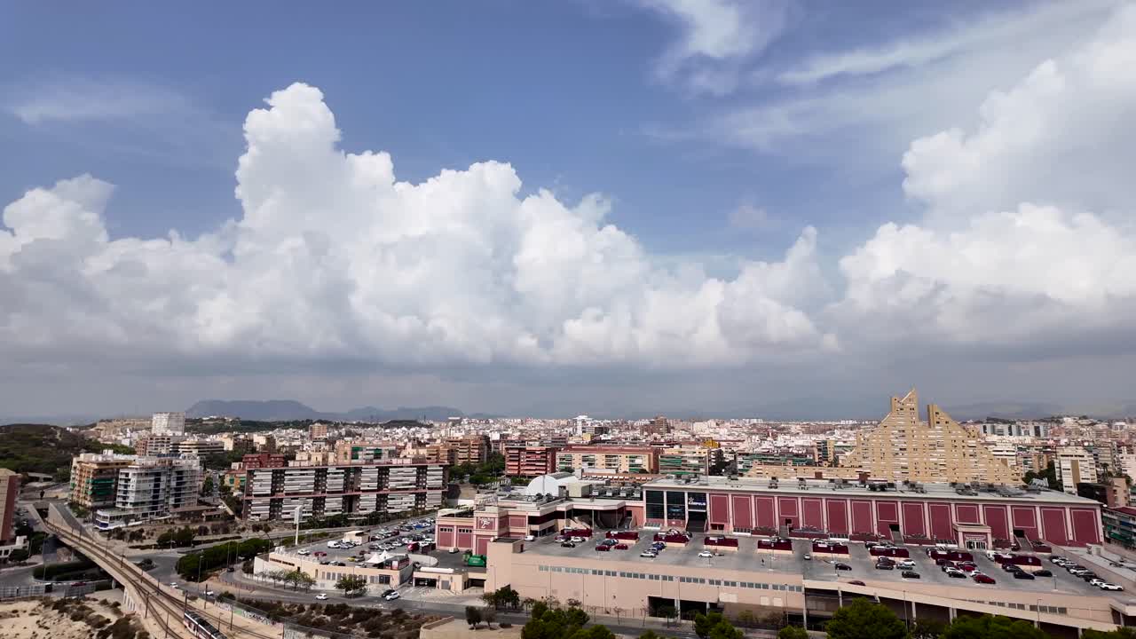Aerial panoramic view of Alicante city in Spain. View of city center and Castle in a summer day with some clouds in a blue sky. 4K