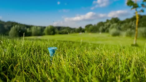 golf tee on a watering golf course