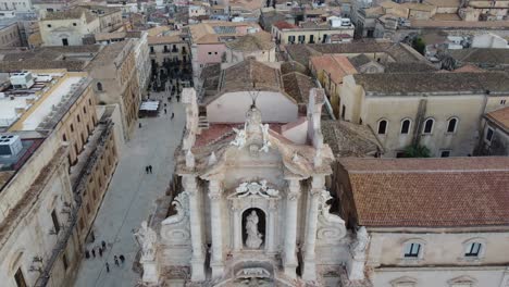 aerial pan of a sicilian baroque cathedral and its main square in syracuse