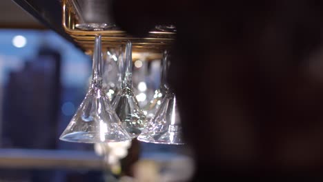 close up of cocktail martini glasses in luxury home together in rack