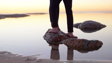 couple standing on rock near sea 4k