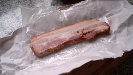 sliced of thick-cut bacon on the table