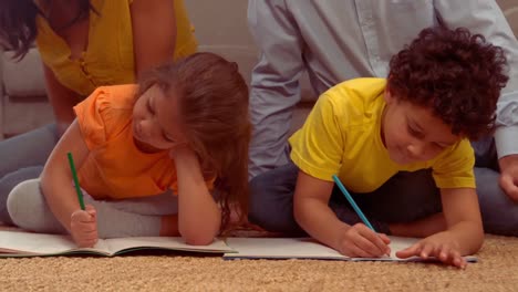 Smiling-Hispanic-children-doing-their-homework-in-the-living-room