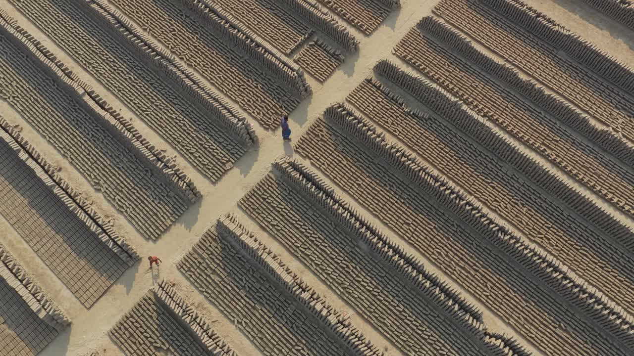 Drone video of brick factory with rows of drying bricks in Bangladesh