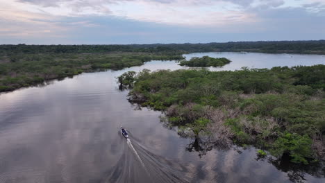 aerial shot canoe amazon river lagoon twilight rainforest cuyabeno reserve ecuador