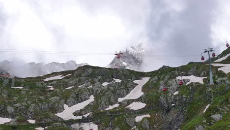 mountain base station with lush green landscapes and winding trails in kaprun, austria, lift tram dollys connect and transport visitors