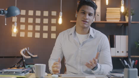 businessman in office setting on video conference