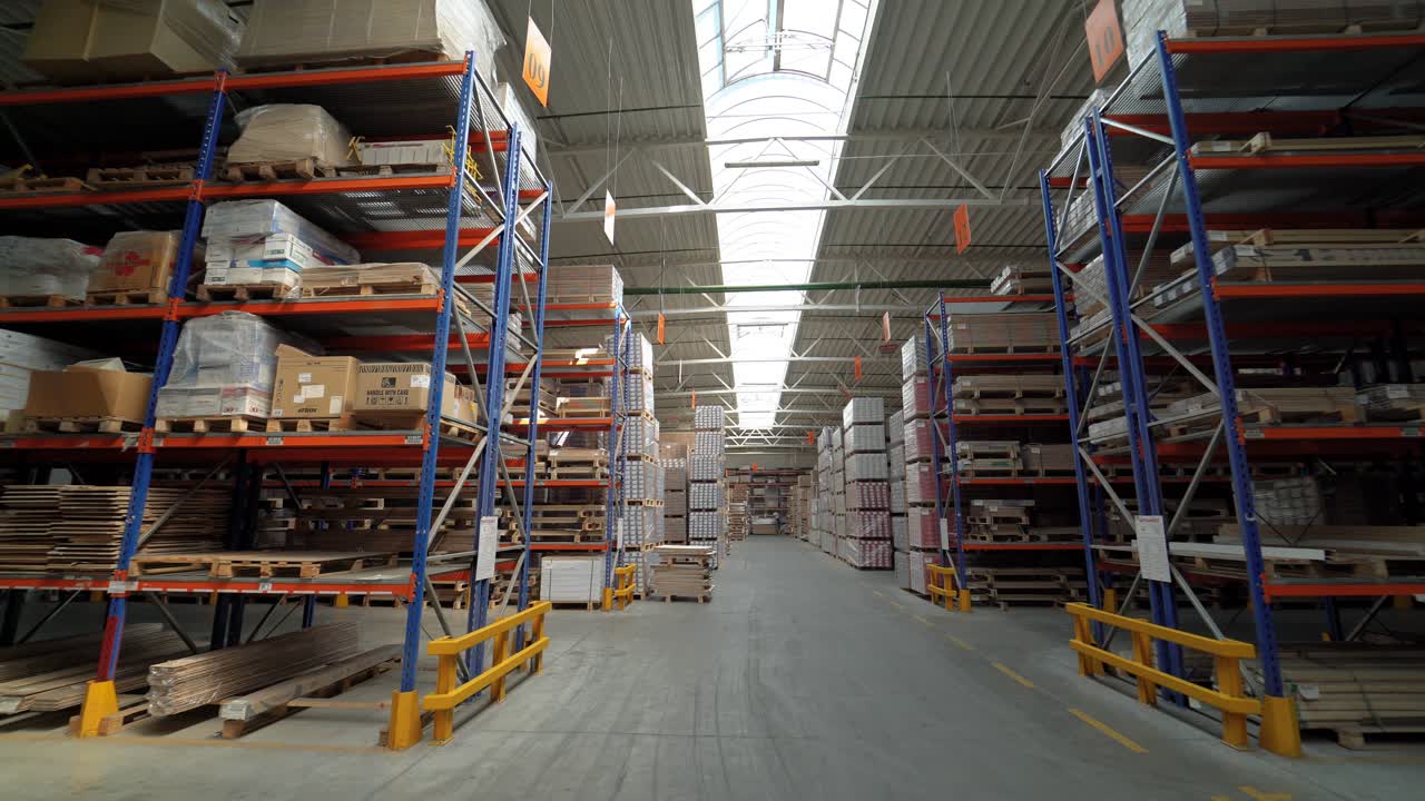 View of the storage with parquet at the factory from the inside. Business. Camera motion to around