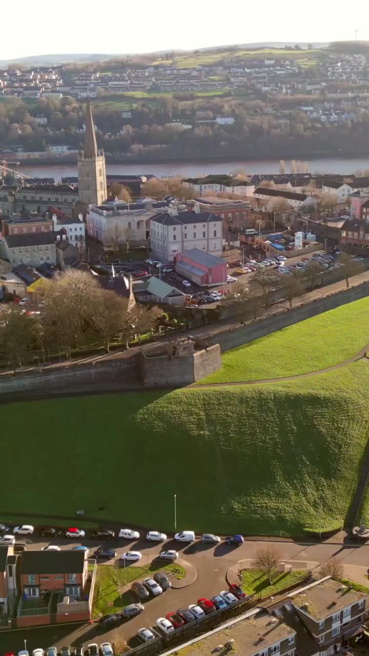Ultra-wide social media ratio aerial GV video of the Derry City Walls in Derry, County Londdonderry in Northern Ireland. Filmed in 1080x1920, 60FPS and with Rec709 color