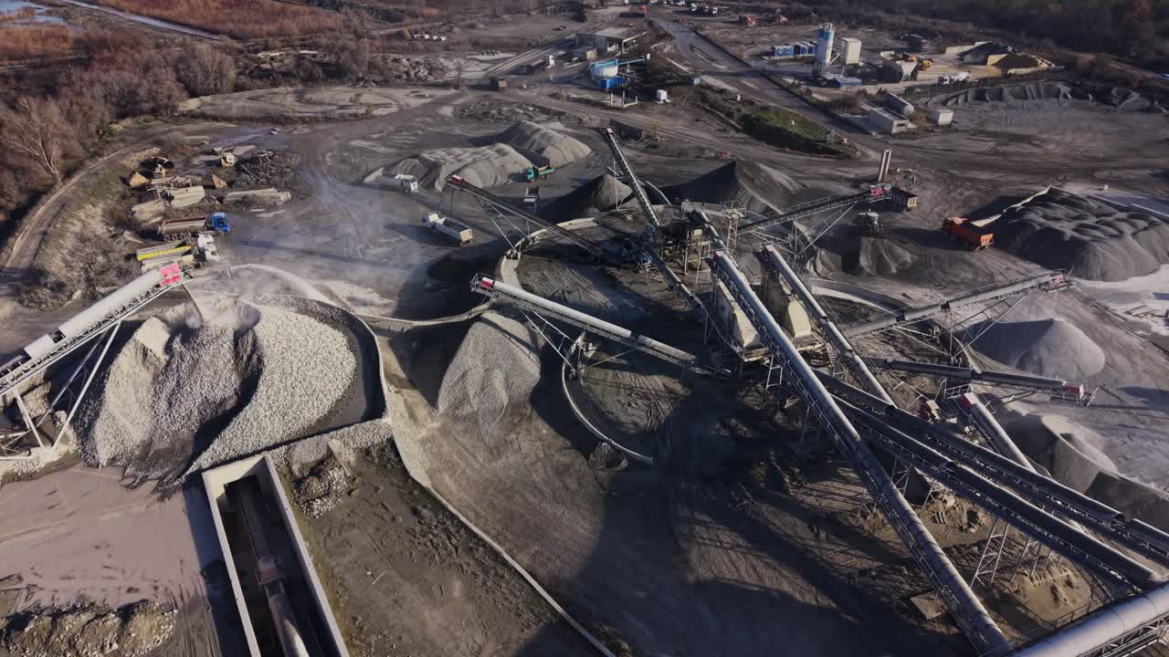 Large quarry area with equipment and piles of material in operation