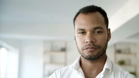 Front-view-of-confident-African-American-man-looking-at-camera