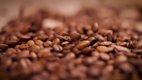 coffee beans dropping in a pile 4k slow motion