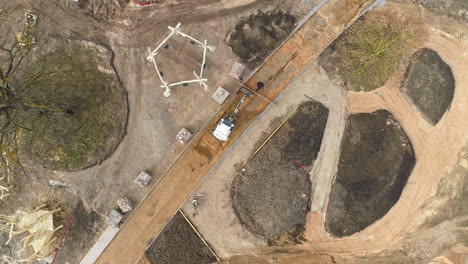 landscaping a public park and playground - straight down ascending aerial spin