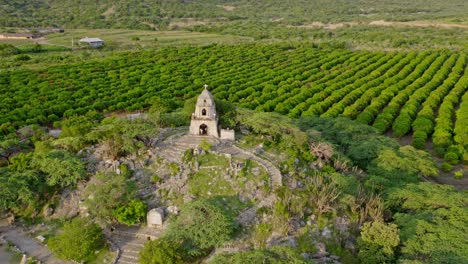 panorama of santuario san martin de porres with rural mango farmland in las tablas, bani, dominican republic