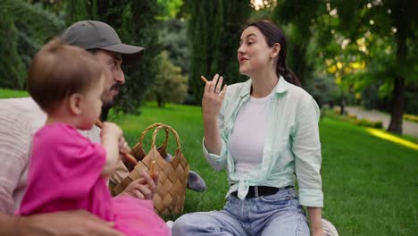 happy family enjoying a picnic in the park