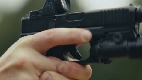 close-up of a hand holding a firearm
