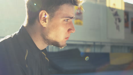 young man eating a sandwich outdoor/indoor