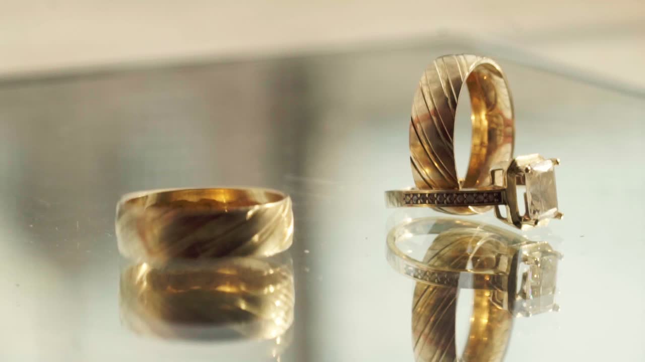 Close-up of wedding rings with reflections