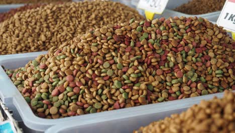 pet food kibble in a bin at a market