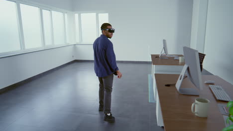 person wearing vr glasses in a modern office