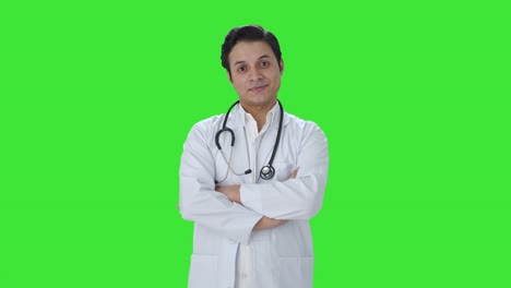 portrait of happy indian doctor green screen