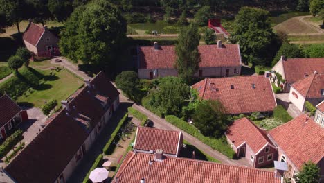 drone view of small houses at fortress bourtange holland during bright summer day, aerial