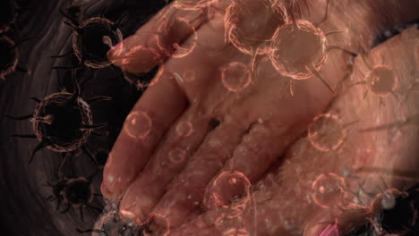 animation of macro coronavirus covid-19 cells spreading from the hands of a caucasian man